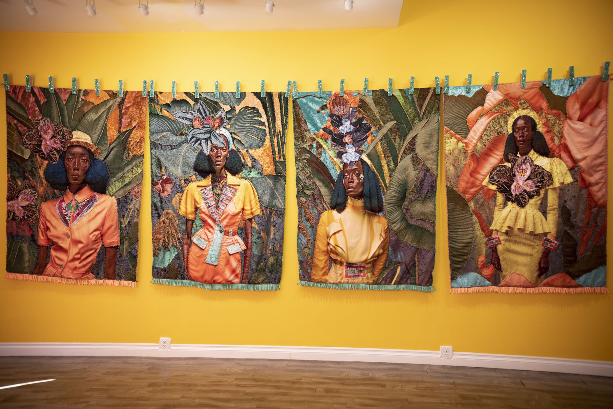 Four portraits of women in yellow dresses.