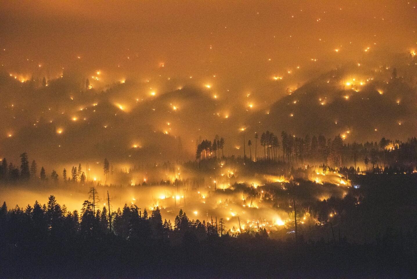 A long-exposure image shows the El Portal fire burning near Yosemite National Park on July 27.
