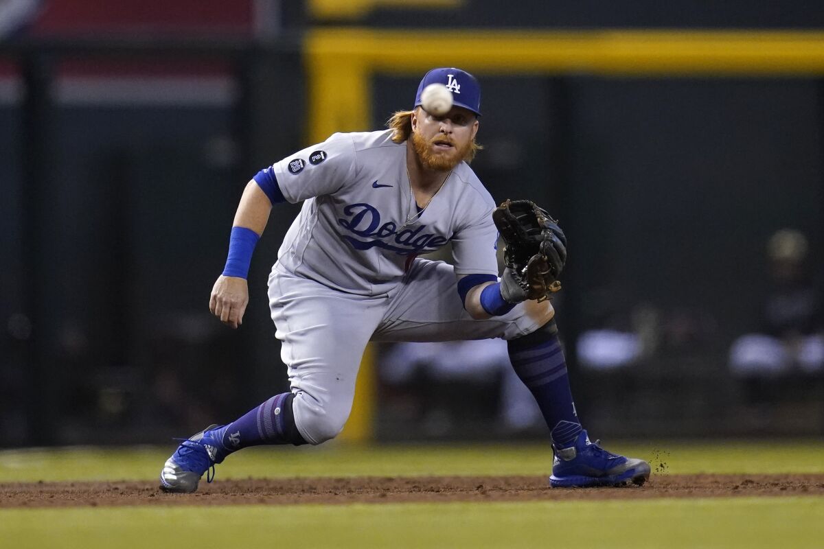 Dodgers third baseman Justin Turner gets ready to make a catch on a line drive.
