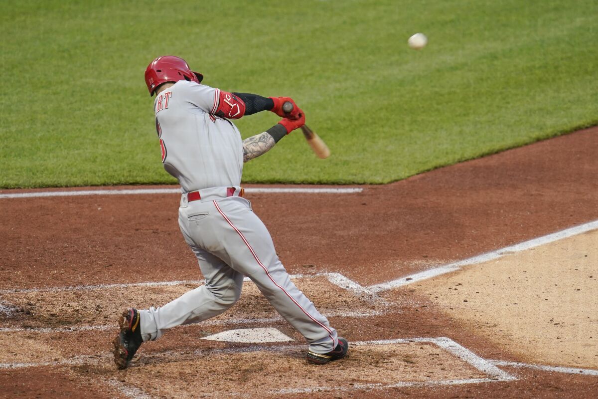 Cincinnati Reds' Tucker Barnhart hits a double to drive in two runs against the Pittsburgh Pirates in the fourth inning of a baseball game, Monday, May 10, 2021, in Pittsburgh. (AP Photo/Keith Srakocic)