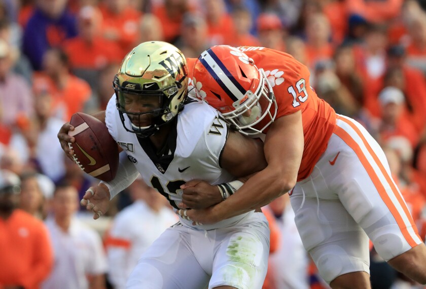 Clemson’s Tanner Muse sacks Wake Forest quarterback Jamie Newman.