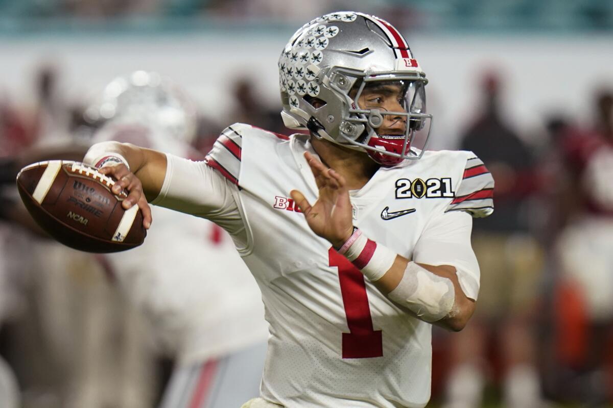 Ohio State quarterback Justin Fields passes during a game.