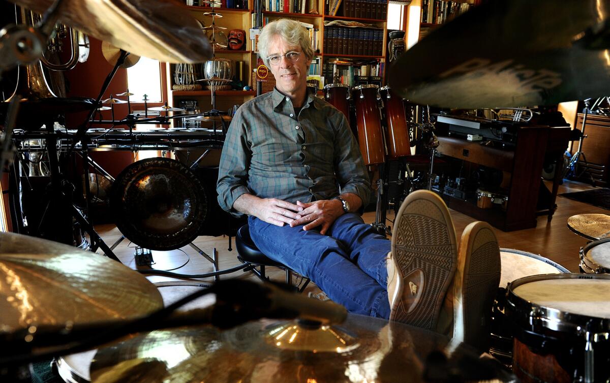 Police drummer Stewart Copeland, shown in his Brentwood studio, wants fans to jam with him over the Internet.