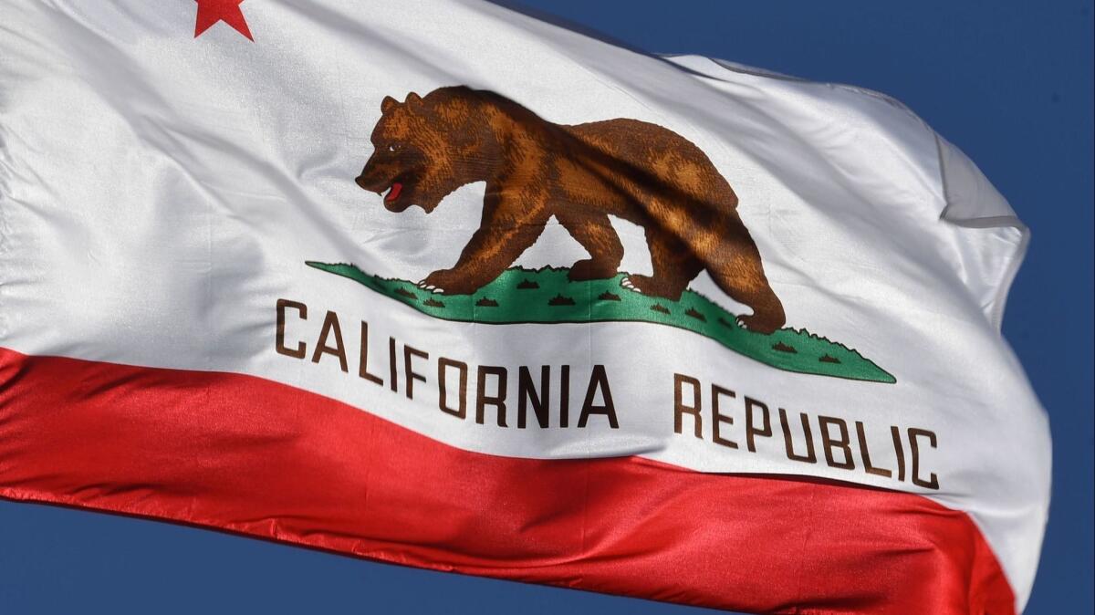 The California state flag flies outside Los Angeles City Hall in 2017.