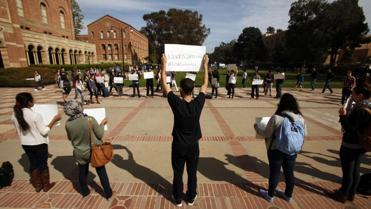 UCLA students protest the university's decision not to divest from companies that conduct business in Los Angeles on March 5, 2014.
