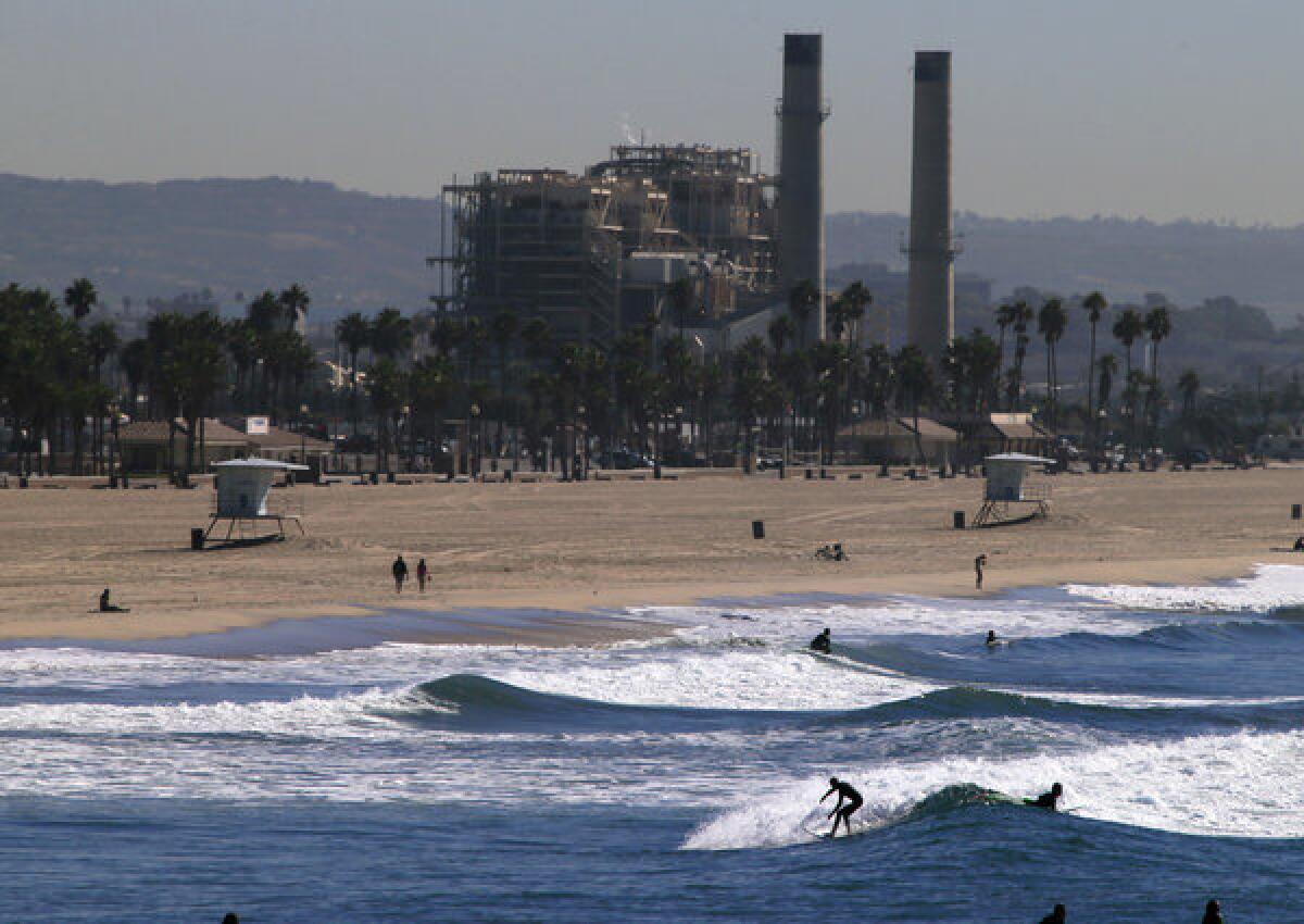 Poseidon Resources wants to build a large seawater desalination plant next to the AES power station in Huntington Beach, pictured in the background.