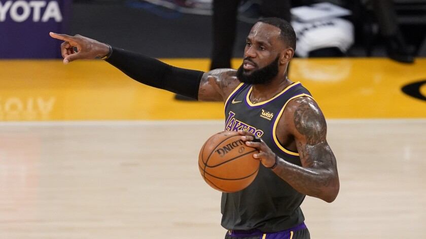 Lakers forward LeBron James calls for a play.