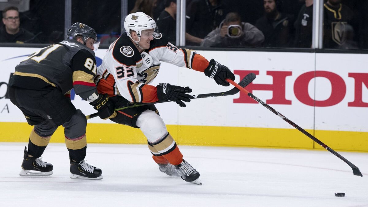 Ducks right wing Jakob Silfverberg (33) battles Vegas Golden Knights center Jonathan Marchessault for the puck during a game earlier this season.