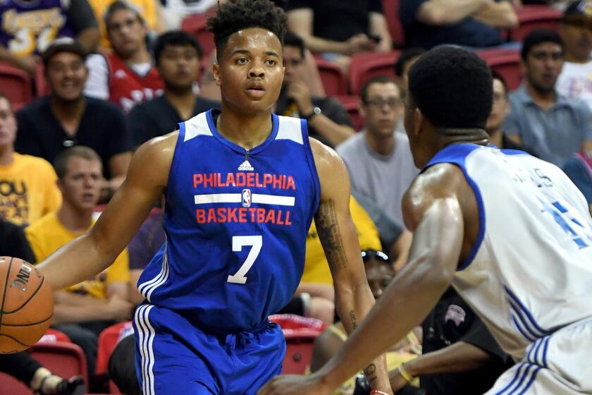 LAS VEGAS, NV - JULY 08: Markelle Fultz #7 of the Philadelphia 76ers is guarded by Damian Jones #15 of the Golden State Warriors during the 2017 Summer League at the Thomas & Mack Center on July 8, 2017 in Las Vegas, Nevada. Philadelphia won 95-93. NOTE TO USER: User expressly acknowledges and agrees that, by downloading and or using this photograph, User is consenting to the terms and conditions of the Getty Images License Agreement. (Photo by Ethan Miller/Getty Images) ** OUTS - ELSENT, FPG, CM - OUTS * NM, PH, VA if sourced by CT, LA or MoD **