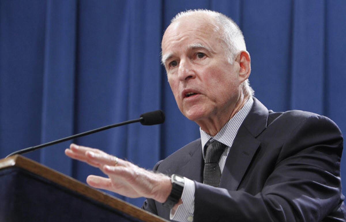 Gov. Jerry Brown discusses his proposal to roll back public employee pension benefits during a news conference at the Capitol in Sacramento.