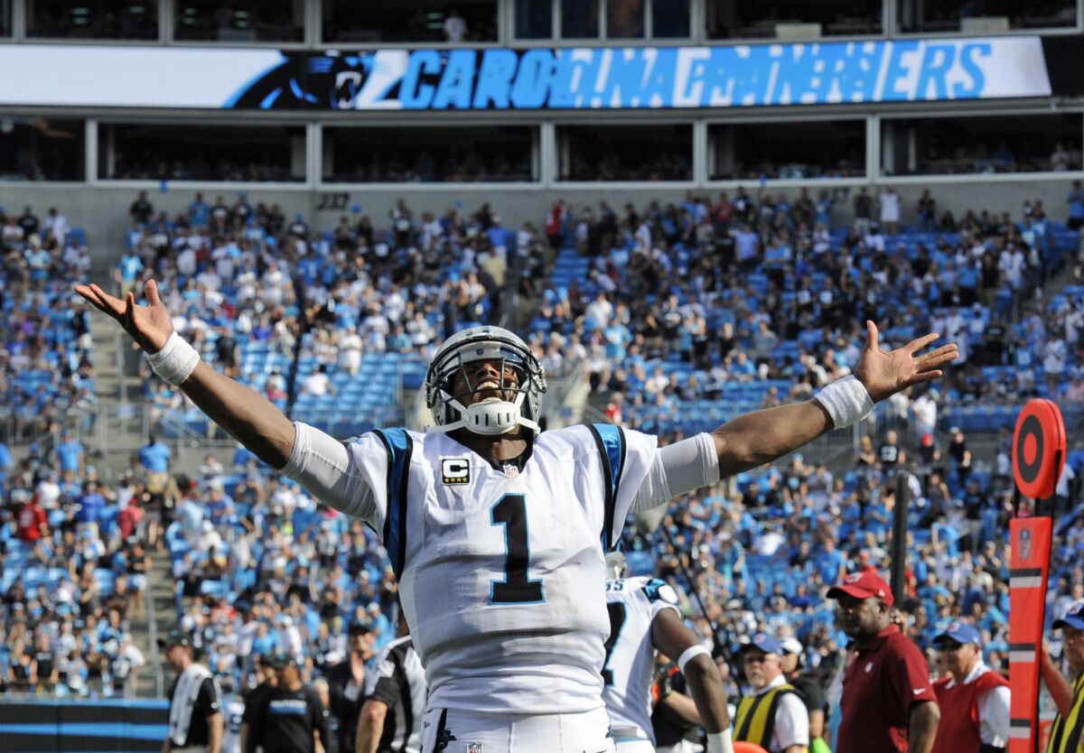 FILE - Carolina Panthers' Cam Newton (1) celebrates a touchdown against the San Francisco 49ers in the second half of an NFL football game in Charlotte, N.C., Sunday, Sept. 18, 2016. According to a person with knowledge of the situation, the Carolina Panthers have agreed to a one-year contact to bring quarterback Cam Newton back to the franchise that drafted him No. 1 overall in 2011. The person spoke to The Associated Press on condition of anonymity Thursday, Nov. 11, 2021, because the deal has not been announced by the team. (AP Photo/Mike McCarn, File)