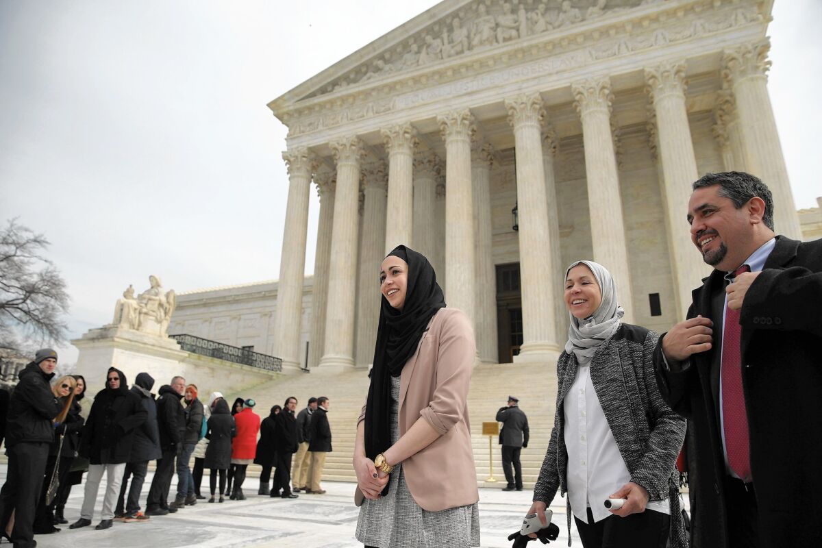 Samantha Elauf, center, her mother and her lawyer leave the U.S. Supreme Court on Feb. 25 after the justices heard arguments in their case against Abercrombie & Fitch.