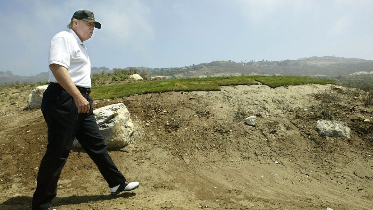 Donald Trump takes an unfinished pathway at the Trump National Golf Club in Rancho Palos Verdes in 2005.