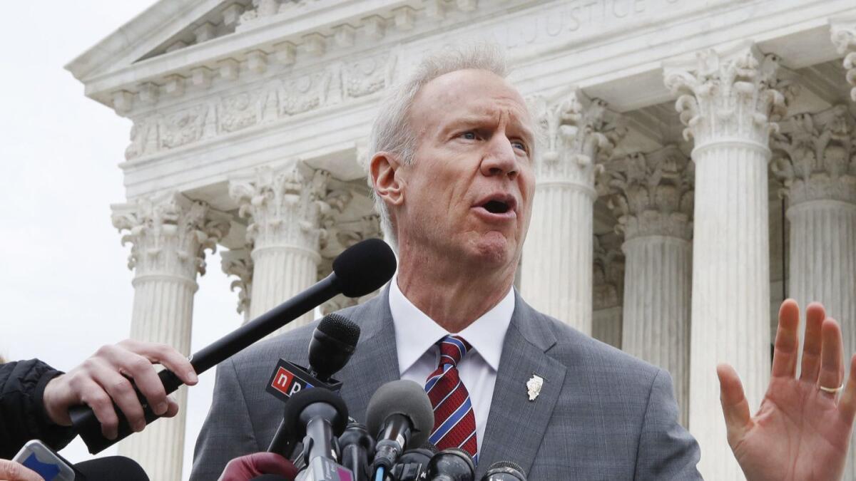 Illinois Gov. Bruce Rauner stands outside the Supreme Court in Washington in February. Rauner launched the original case that resulted in the court's ruling on so-called fair share union fees.