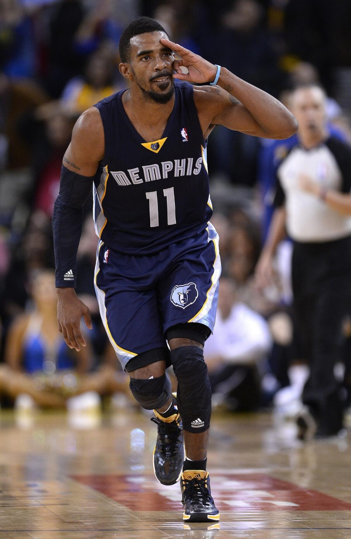 Memphis point guard Mike Conley reacts after hitting a three-pointer against the Golden State Warriors on Nov. 20.