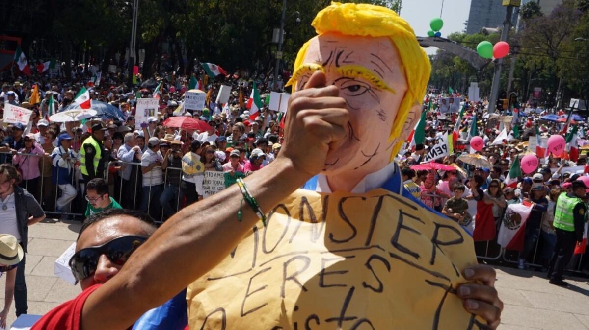 Mexican Police said more than 20,00 people marched in Mexico City along Paseo de la Reforma at a rally protesting immigration and trade policies of President Trump.