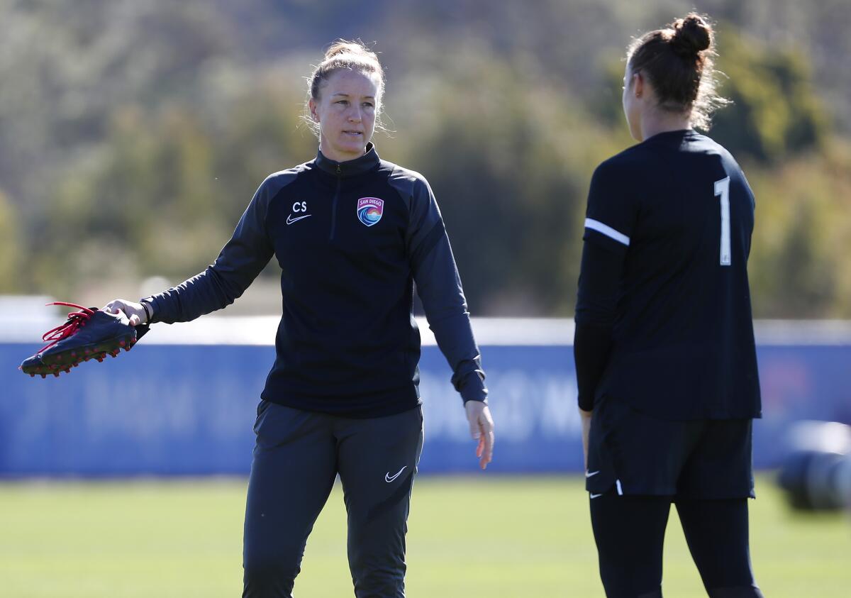 San Diego Wave FC head coach Casey Stoney, left, is shown during a recent practice at Surf Sports Park.