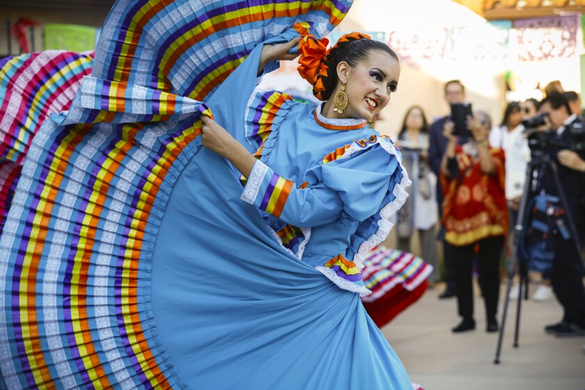 Performers dance during the House of Mexico cottage 's long awaited grand opening day last fall.