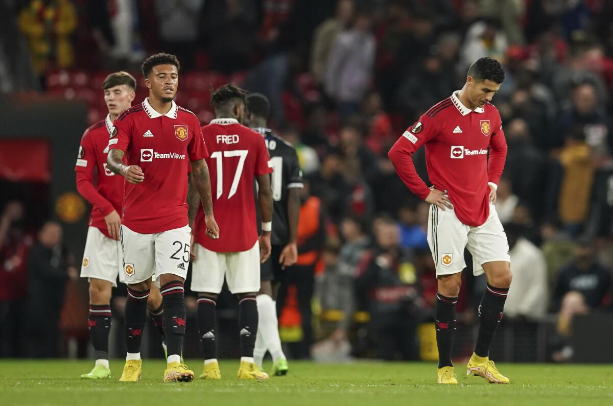 Manchester United's Cristiano Ronaldo and team mates stand dejected at full time after defeat during group E Europa League soccer match between Manchester United and Real Sociedad at Old Trafford in Manchester, England, Thursday, Sept. 8, 2022. (AP Photo/Dave Thompson)