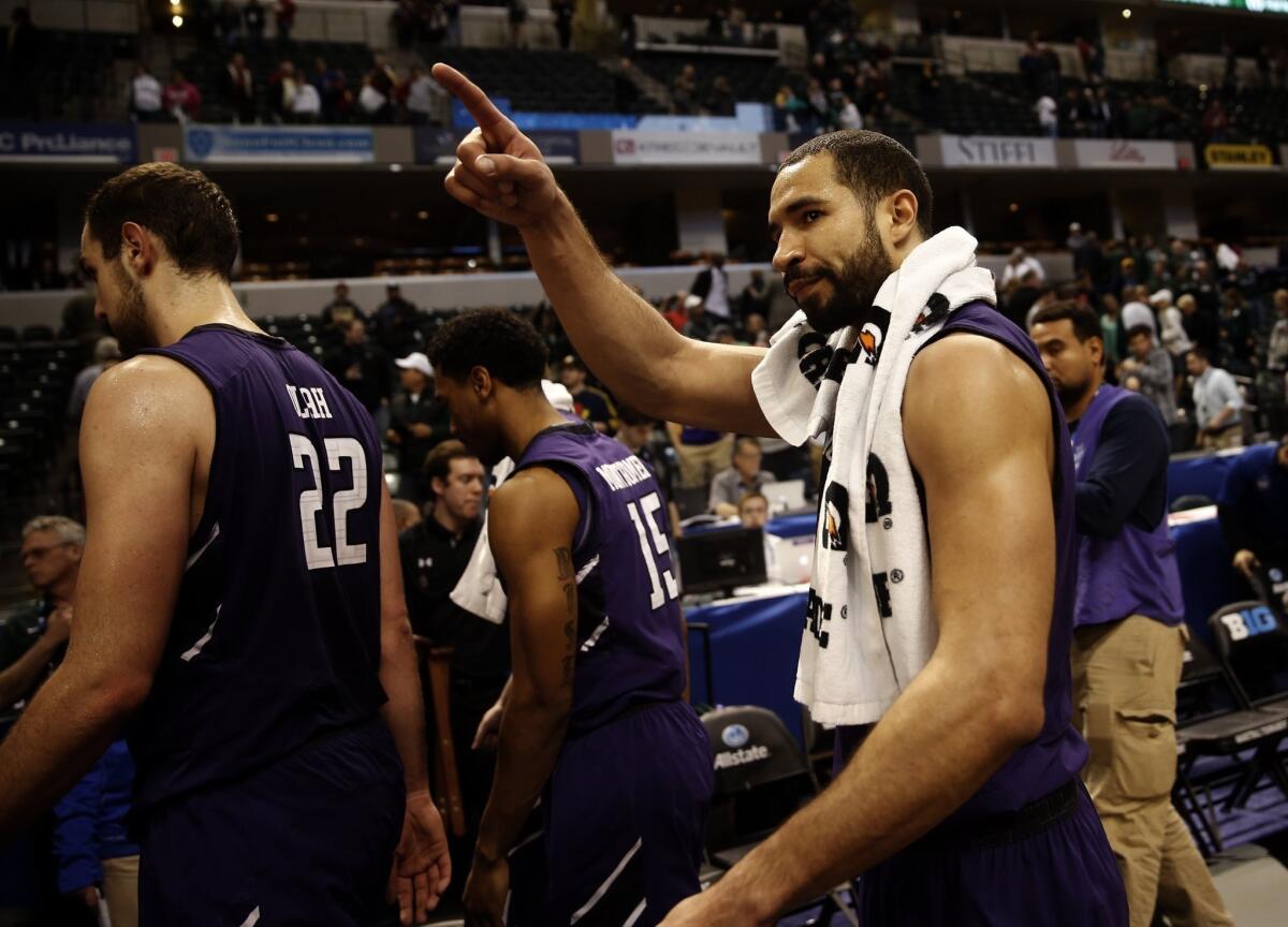Northwestern's Drew Crawford leaves the court after the Wildcats' loss to Michigan State, 67-51, in the Big Ten tournament quarterfinals on March 14.