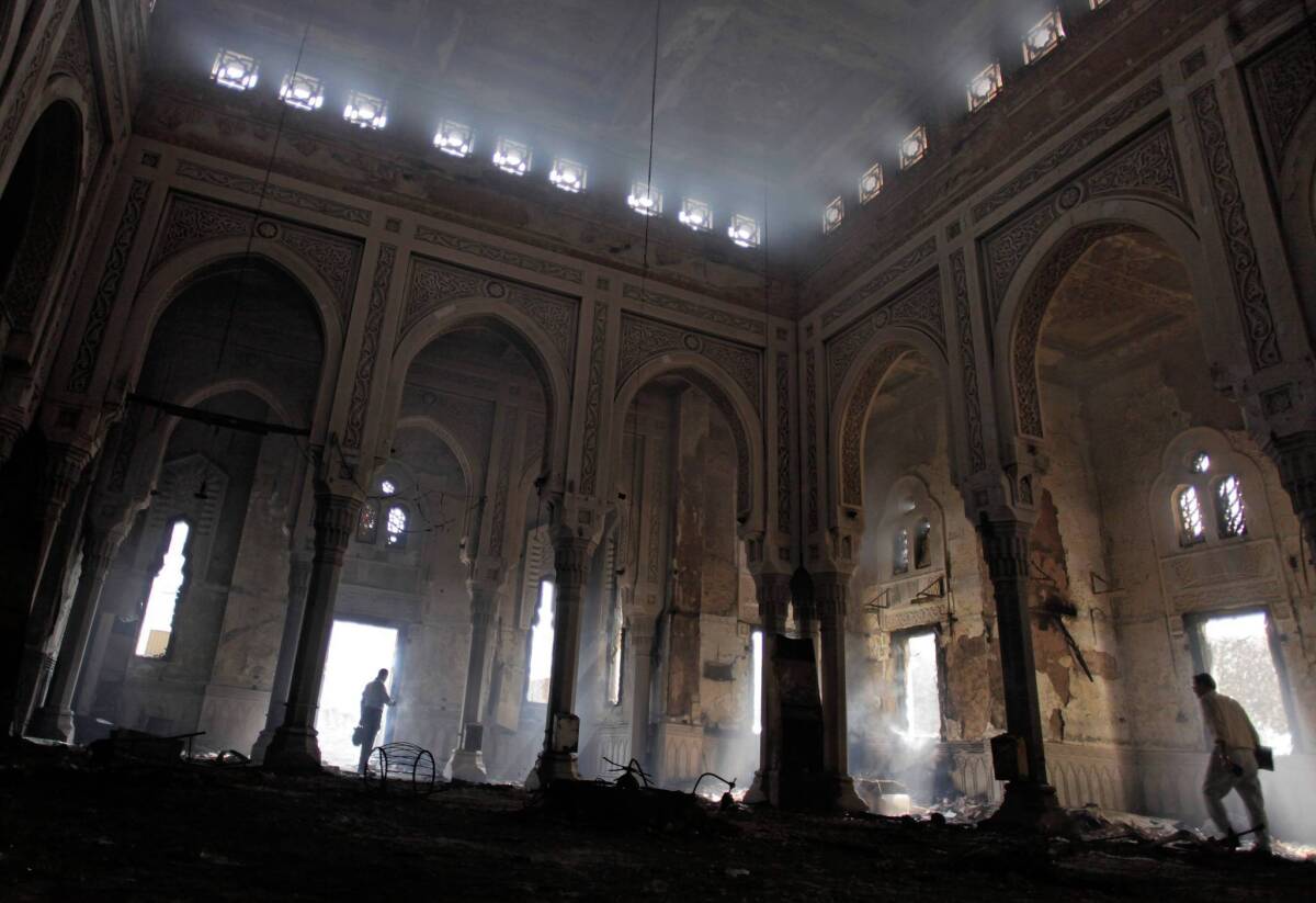 Egyptians tour the charred Rabaa al Adawiya mosque in August, after the military ousted Islamists who had set up camp in the area in Cairo.
