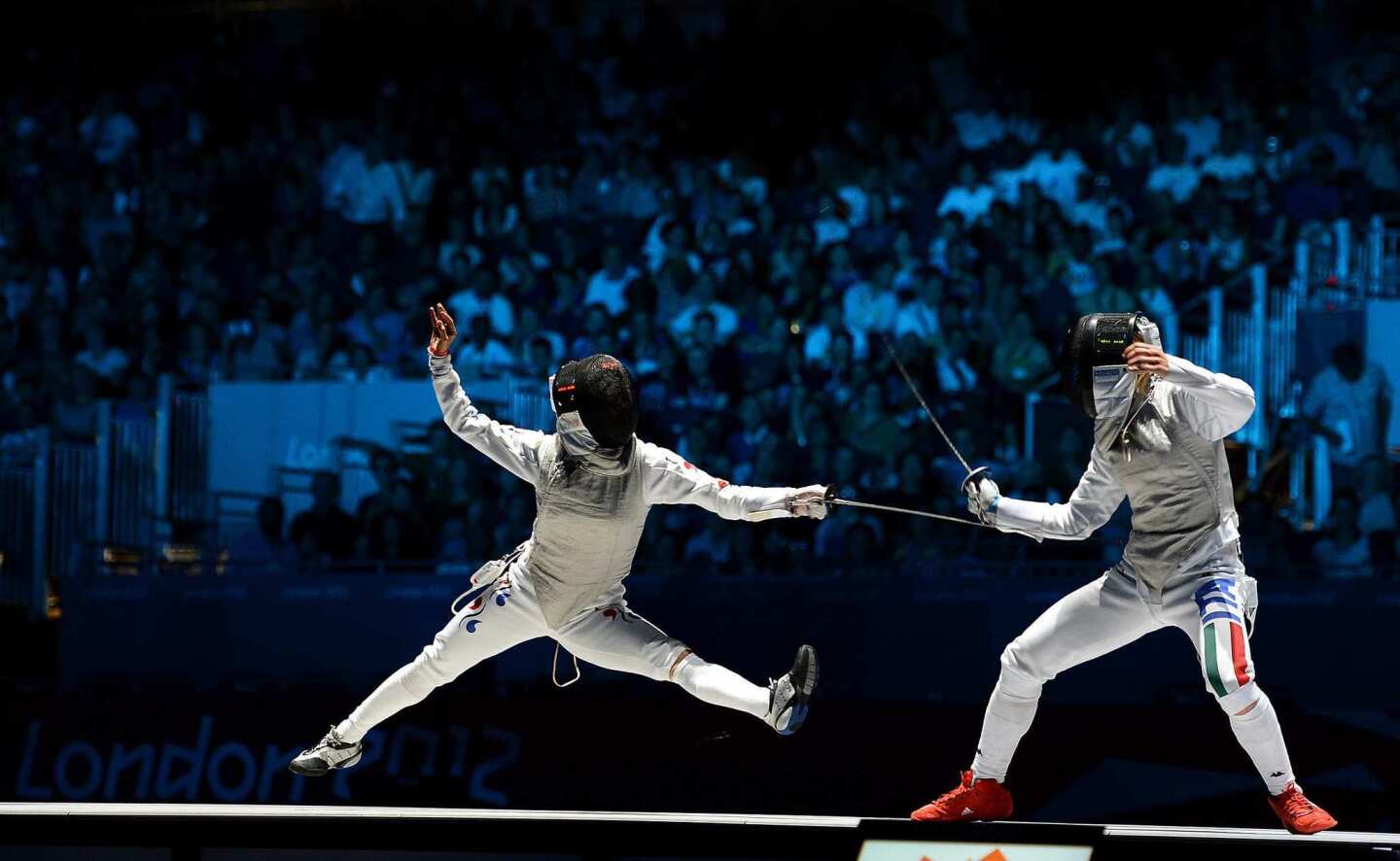 South Korea's Nam Hyun-hee, left, loses to bronze medal winner Valentina Vezzali of Italy in the women's foil individual event.