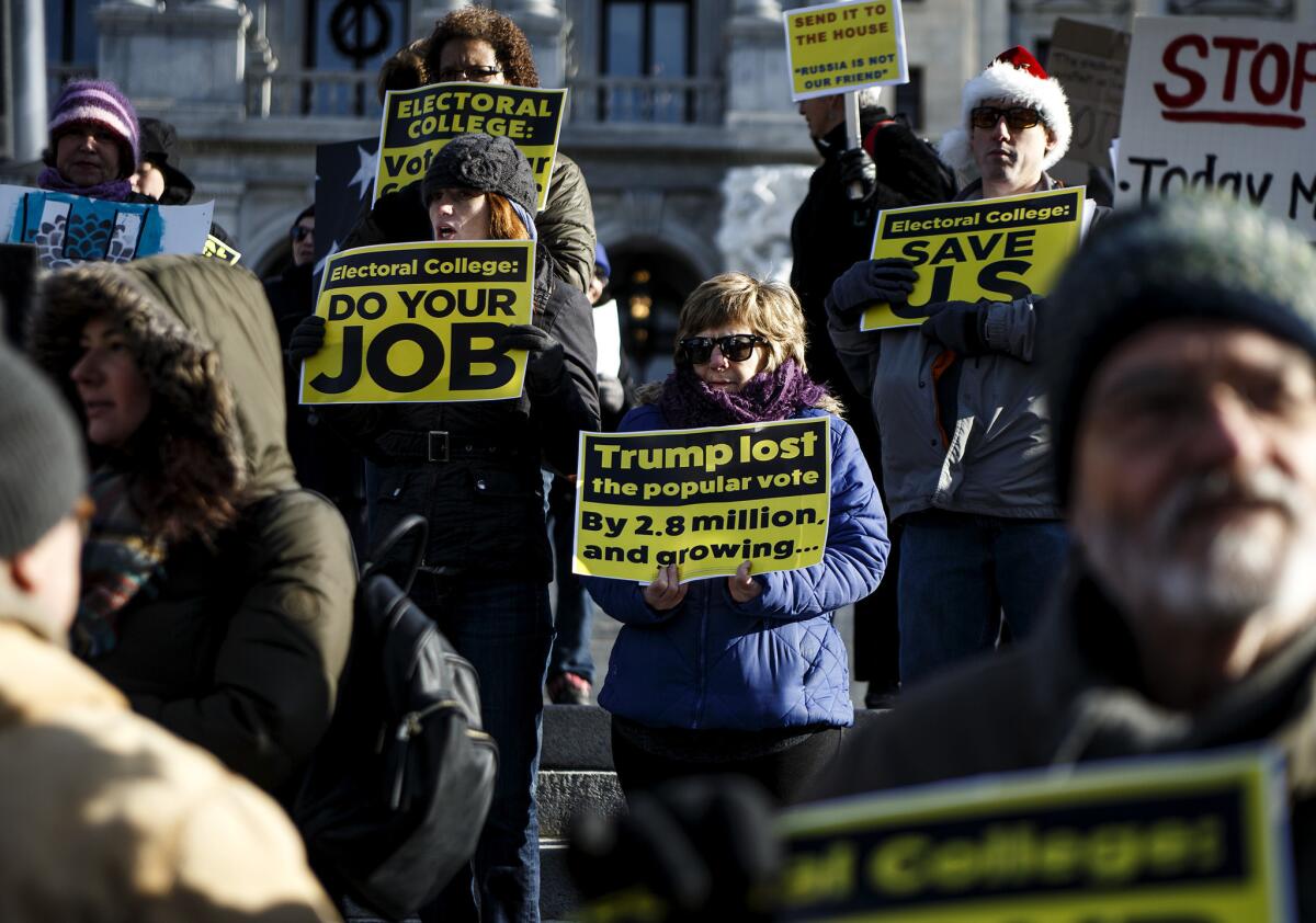 Protesters demonstrate ahead of the electoral college vote at the Pennsylvania Capitol in Harrisburg on Monday morning.