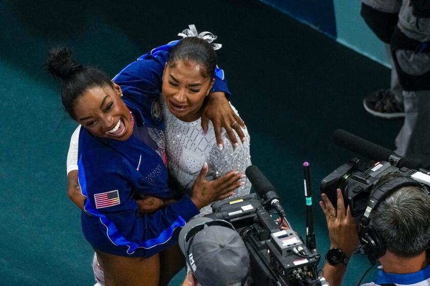 Jordan Chiles, of the United States, and Simone Biles, of the United States, celebrate after the women's artistic gymnastics individual floor finals in Bercy Arena at the 2024 Summer Olympics, Monday, Aug. 5, 2024, in Paris, France. Biles won the silver medal and Chiles the bronze medal. (AP Photo/Morry Gash)