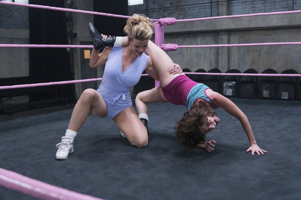 Betty Gilpin, left, and Alison Brie star as pro wrestlers going beyond the mat in Netflix's "GLOW."