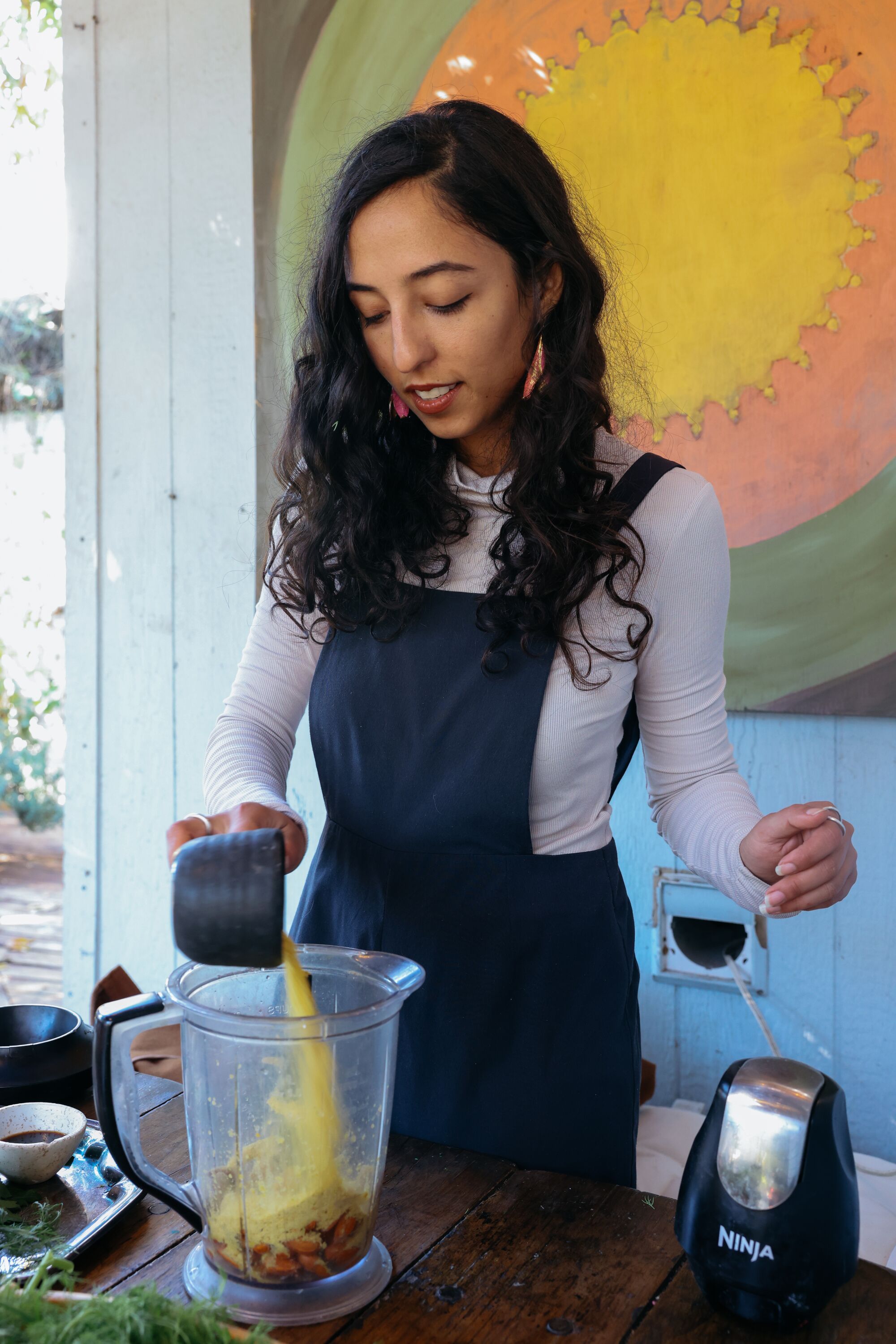 Los Angeles, CA - November 10: Sorina Vaziri prepares a Krishna salad in her garden 