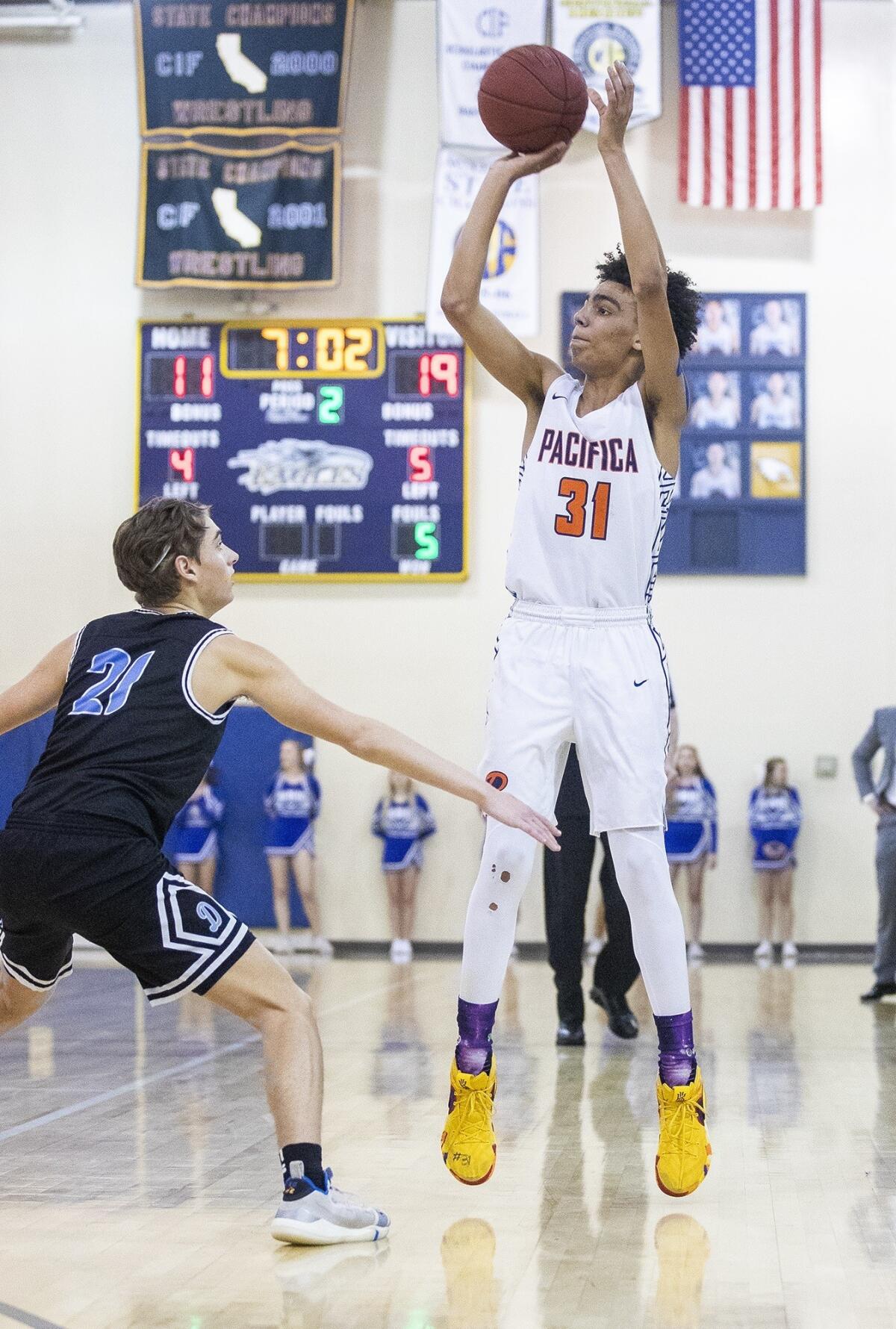 Pacifica Christian Orange County High's Houston Mallette goes up for a shot against Dana Hills' Grayson Holtby during a CIF Southern Section Division 4AA quarterfinal playoff game on Thursday.
