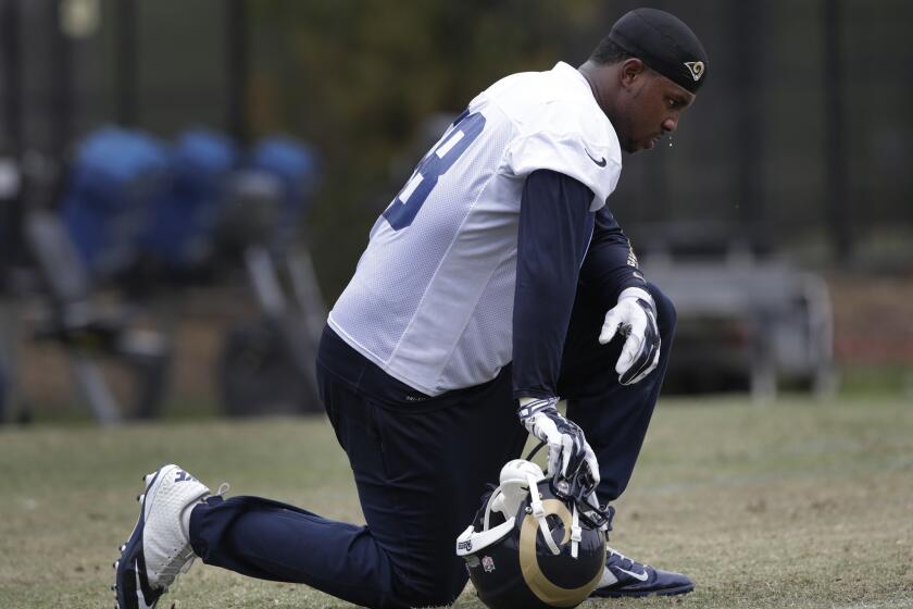 Rams defensive end Quinton Coples catches his breath during practice on June 1.