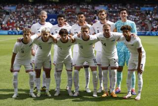 The United States team pose for a group photo before the quarterfinal men's soccer match.