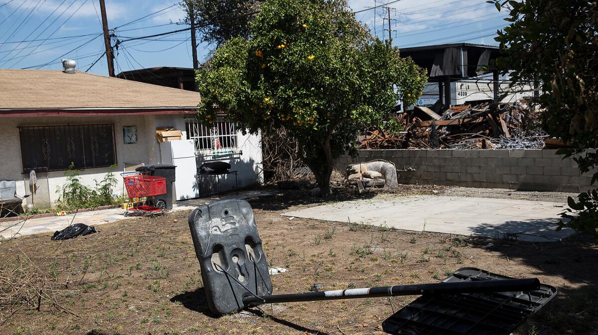 Yesenia Jaramillo's home is adjacent to the metal recycling facility that burned in Maywood.