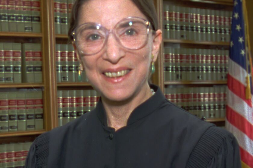 FILE - In this April 3, 1993, file photo, Judge Ruth Bader Ginsburg poses in her office at U.S. District Court in Washington. The Supreme Court says Supreme court Justice Ruth Bader Ginsburg has died of metastatic pancreatic cancer at age 87. (AP Photo/Doug Mills, File)