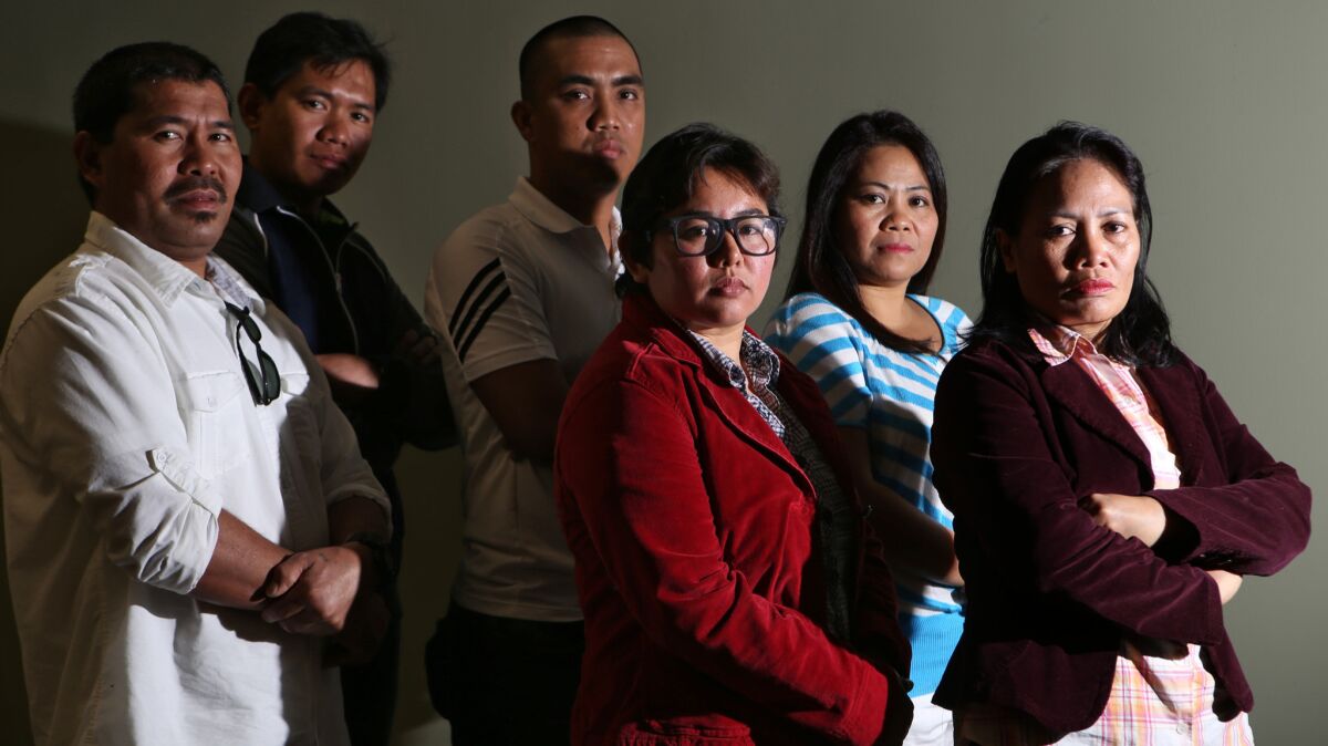 Eleven Filipino bakery workers who sued the now-shuttered L'Amande French Bakery over labor exploitation include, from left, Fernan Belidhon, Elmer Genito, Romar Cunanan, Louise Luis, Gina Pablo and Ermita Alabado.