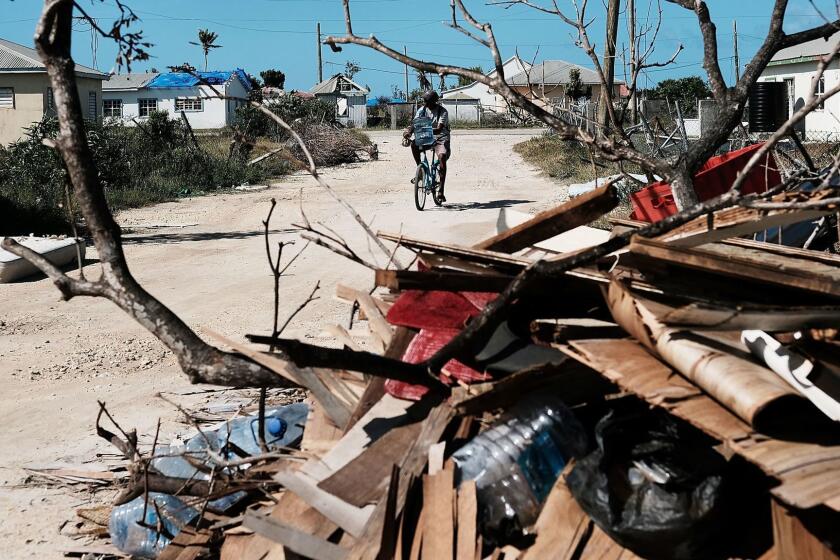 CODRINGTON, BARBUDA - DECEMBER 08: Debris from damaged homes lines a street on the nearly destroyed island of Barbuda on December 8, 2017 in Cordington, Barbuda. Barbuda, which covers only 62 square miles, was nearly leveled when Hurricane Irma made landfall with 185mph winds on the night of September six. Only two days later, fearing Barbuda would be hit again by Hurricane Jose, the prime minister ordered an evacuation of all 1,800 residents of the island. Most are now still in shelters scattered around Barbuda's much larger sister island Antigua. (Photo by Spencer Platt/Getty Images) ** OUTS - ELSENT, FPG, CM - OUTS * NM, PH, VA if sourced by CT, LA or MoD **