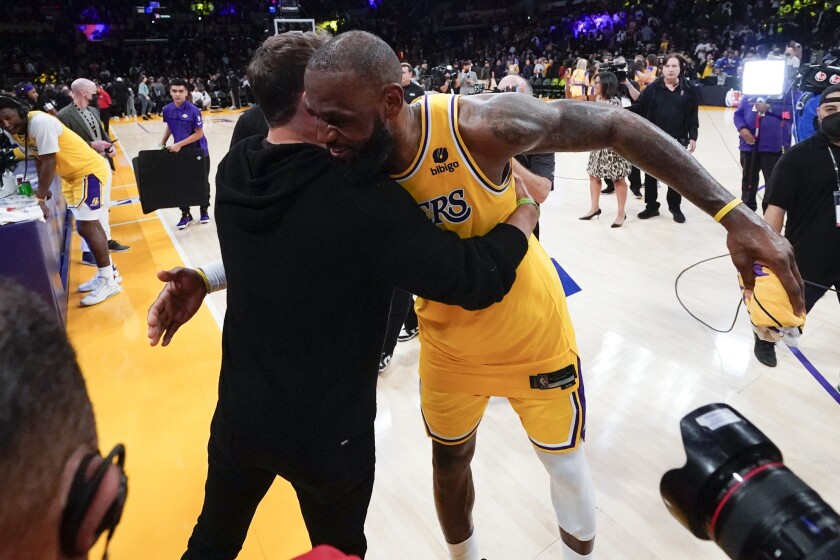 LeBron James of the Lakers hugs Rams quarterback Matthew Stafford after L.A.'s win March 5, 2022.