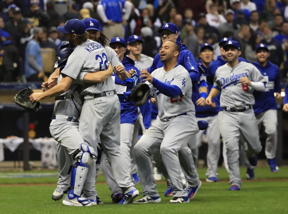 The Dodgers celebrate their Game 7 victory over the Milwaukee Brewers in the NLCS on Saturday.