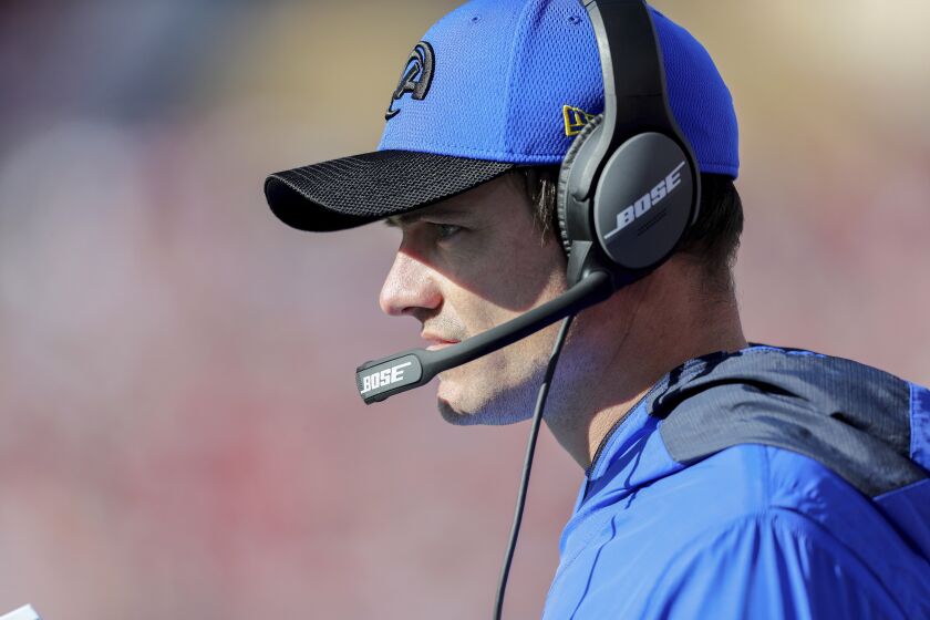 Los Angeles Rams offensive coordinator Kevin O'Connell coaches on the sideline the playoffs.