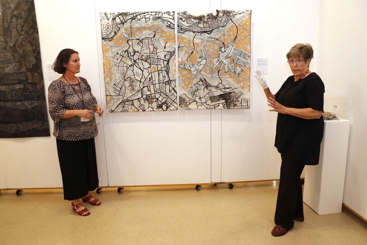 Visions Museum of Textile Art Executive Director Laura Mitchell (left) and board member Carol Sebastian-Neely