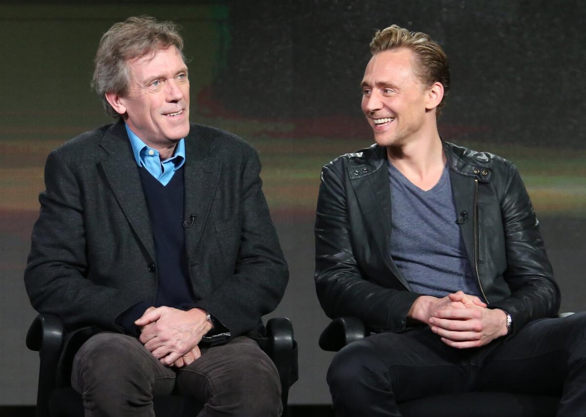 Hugh Laurie, left, and Tom Hiddleston talk about their new miniseries, AMC's "The Night Manager," on Friday at the Television Critics Assn. press tour.