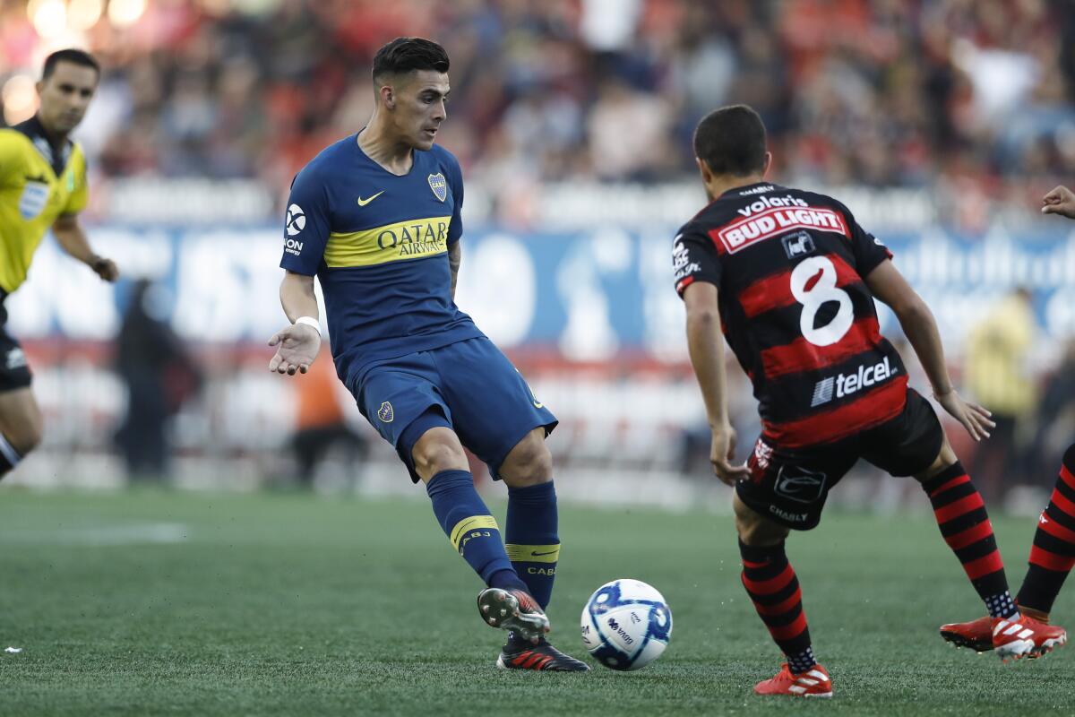 Boca Juniors' Cristian Pavon passes during a friendly soccer match against Tijuana on July 10 in  Mexico.