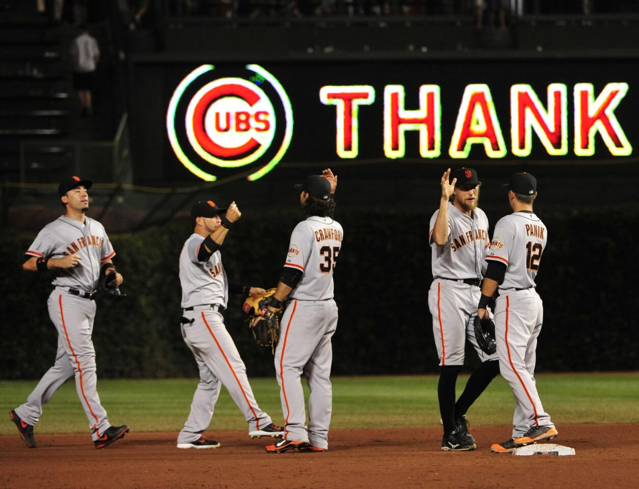 The Giants celebrate their win against the Cubs on Wednesday.