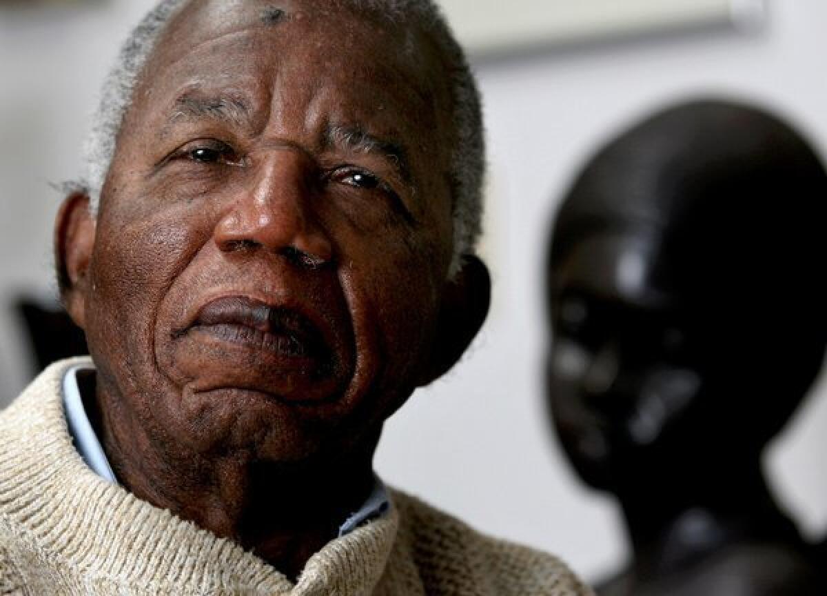 Chinua Achebe posed in 2008 at his home on the campus of Bard College in New York.