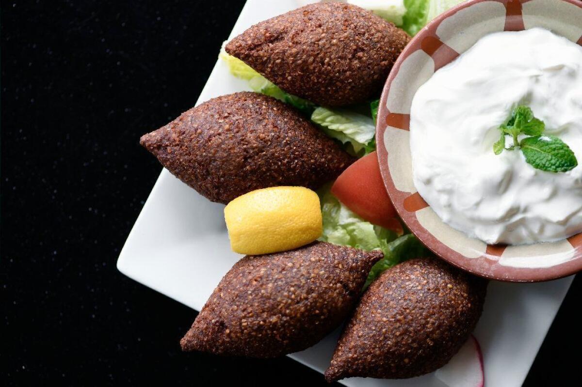 Hayat Kitchen's fried version of kibbeh is served with yogurt.