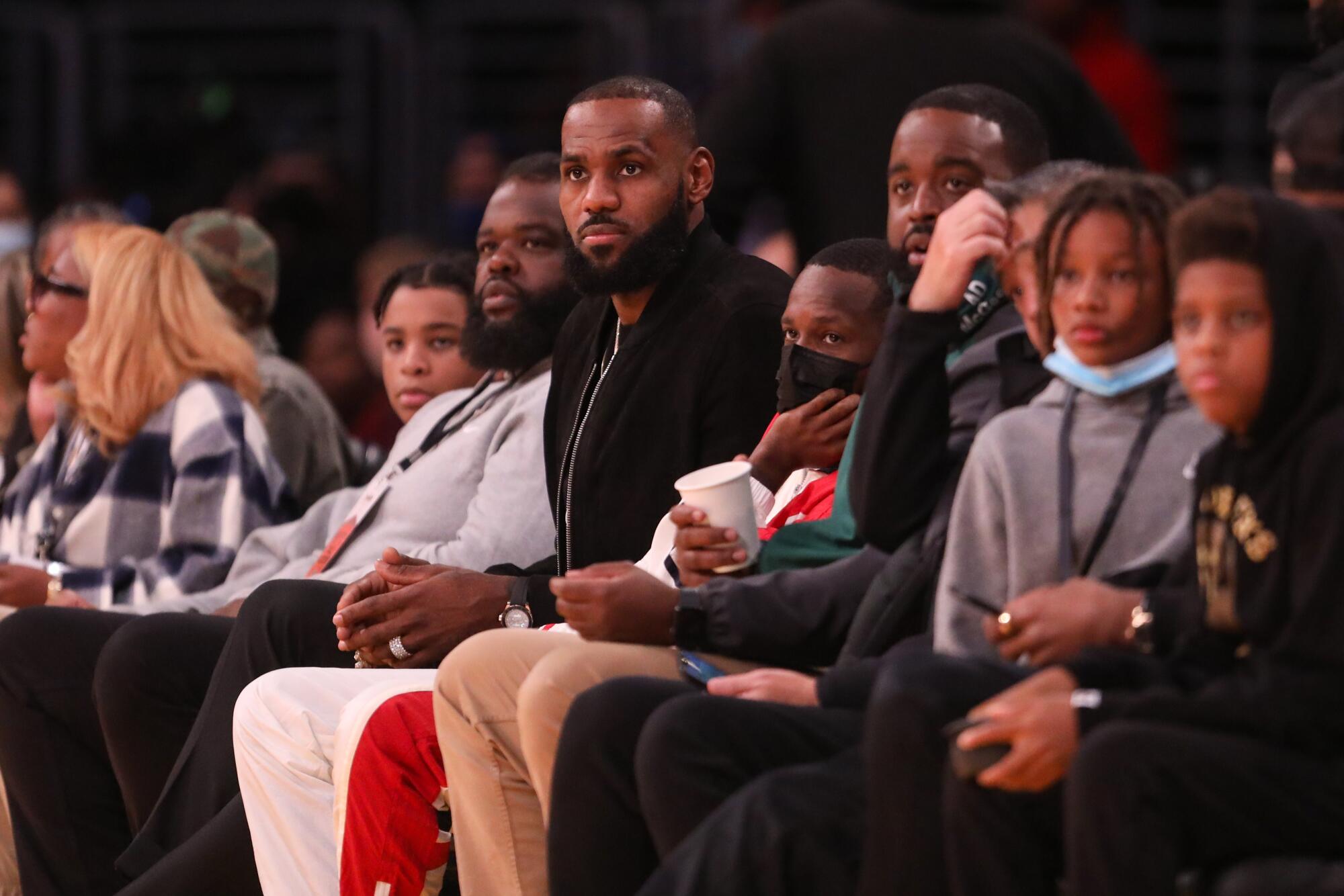 Lebron James watches his son Bronny play for Sierra Canyon in The Chosen-1's Invitational showcase at Staples Center.