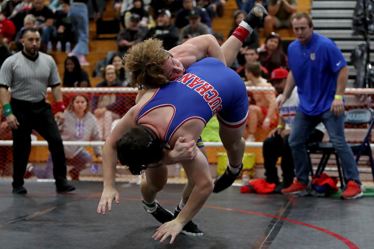 Fountain Valley's Ryland Whitworth drops Clovis Buchanan's Keanu Trelles to the mat during the 195-pound final.