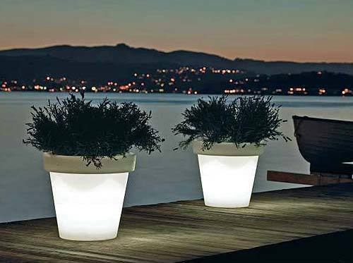 The Bloom Pot can do double duty, lighting a backyard deck while cradling your favorite flowers. Each pot, $328, contains four embedded LEDs that glow when plugged in. The lights are good for more than 40,000 hours, says Design Within Reach, (800) 944-2233, www.dwr.com.