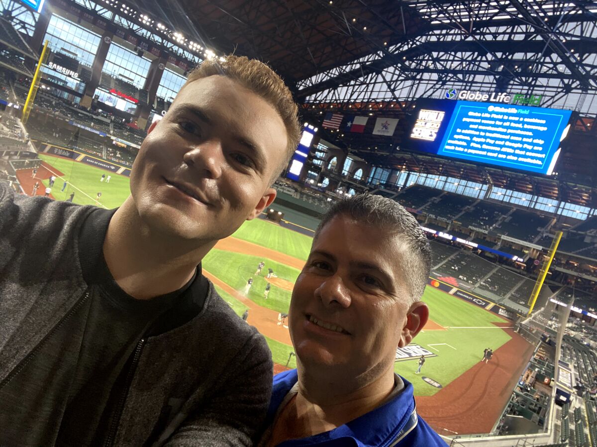 Jonathan Cottrell, left, and Erik Braverman take a selfie at the 2020 World Series in Arlington, Texas.